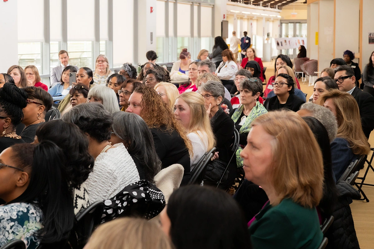 Attendees on the second floor of the University Commons listening to a Ted Talk about leadership led by LaVada V. English '02, WWL '25.
