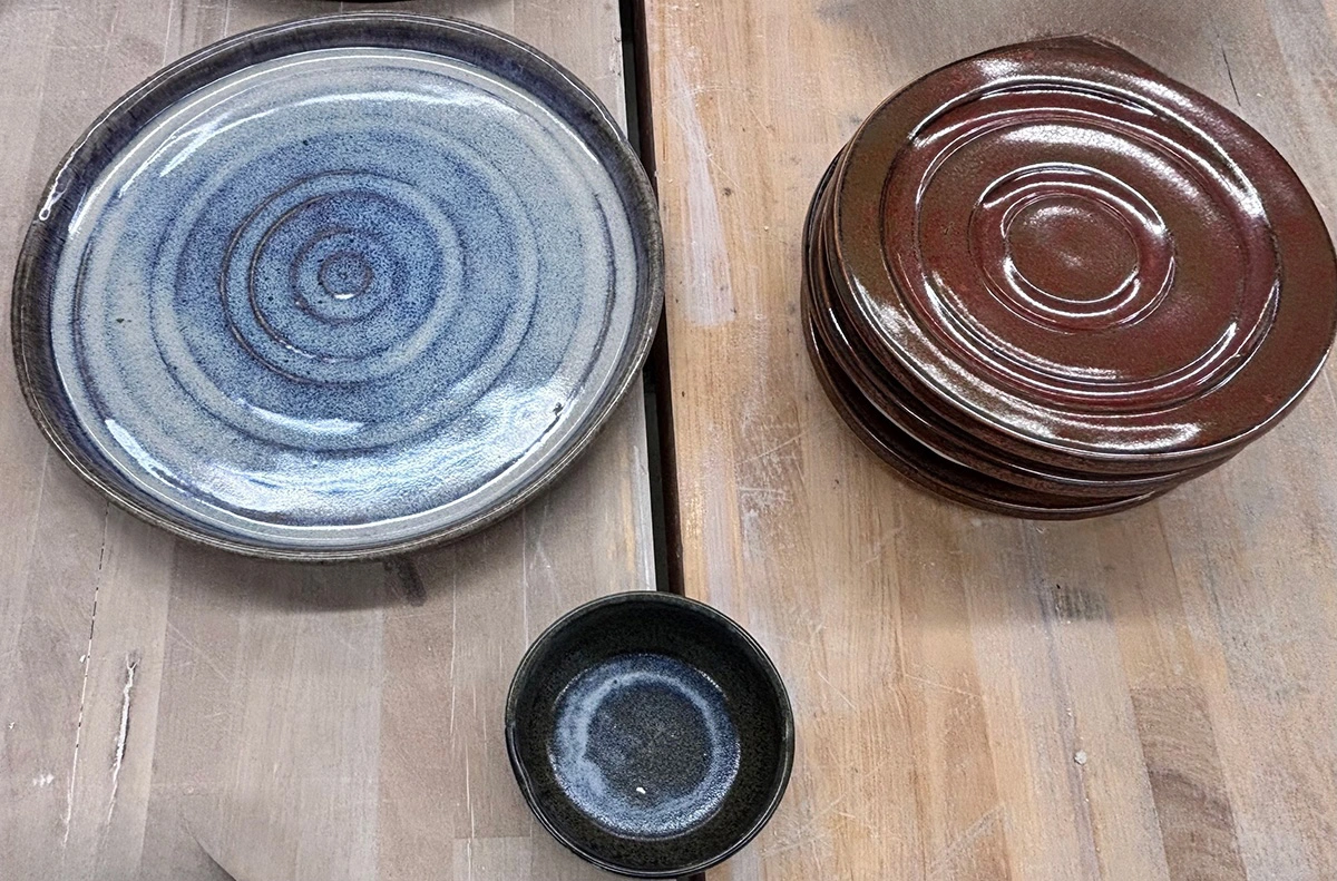 A ceramic plate, bowl, and dessert bowl